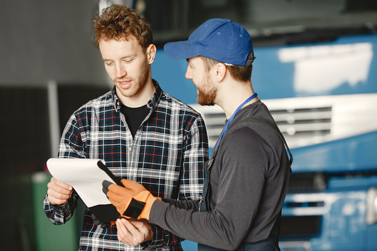 Photo of 2 men discussing an HVAC replacement