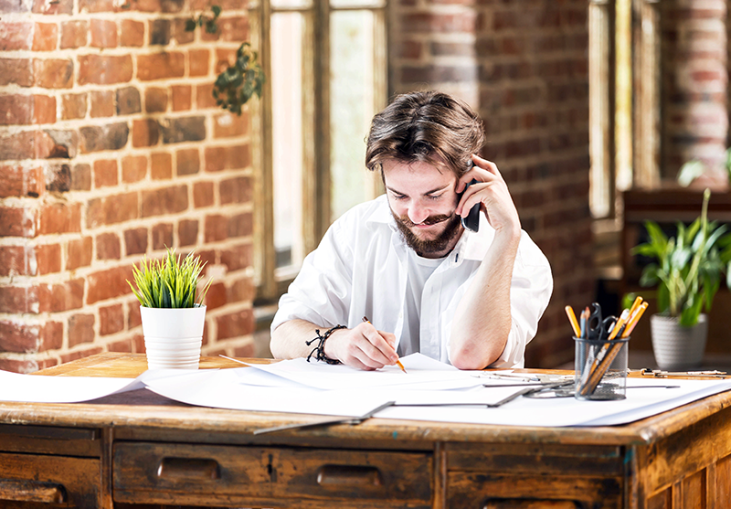 Photo of man talking on the phone with his insurance company