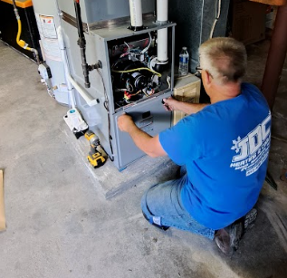 Photo of JDC Heating & Cooling working on a furnace in Pittsburgh